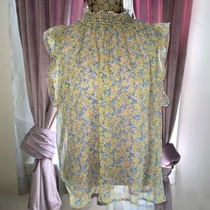 Flowy floral sleeveless blouse size L